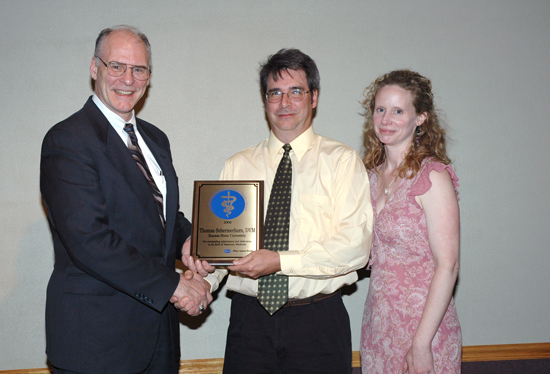 Dr. Thomas Schermerhorn receives the Carl J. Norden Distinguished Teaching Award from Dean Ralph Richardson