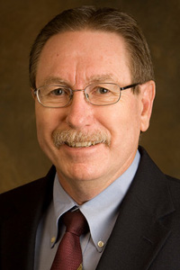 Dr. Dennis "Denny" E. Hausmann