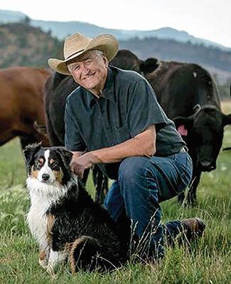 Portrait of Dr.Novy and his dog in a cattle pasture