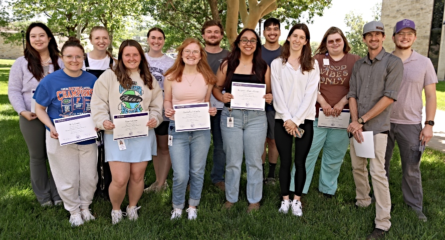 Graduate students standing outside of Coles Hall