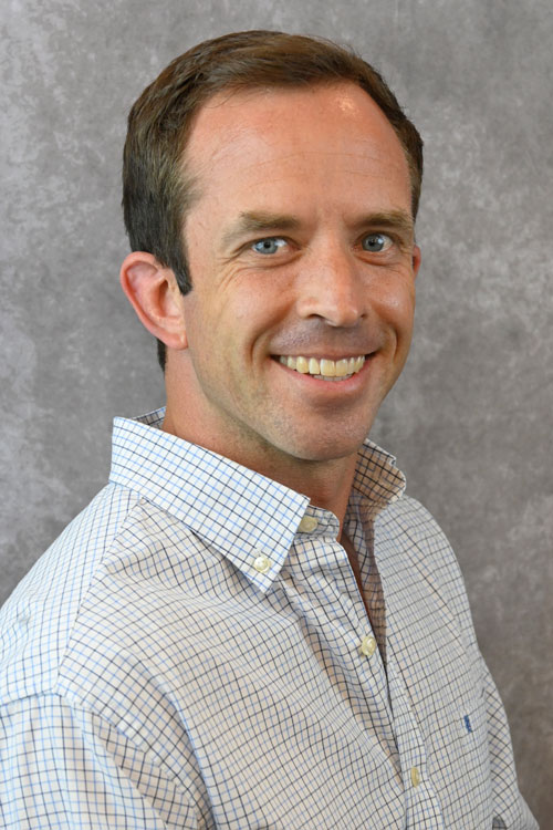 Headshot of Dr. Adam Bassett.
