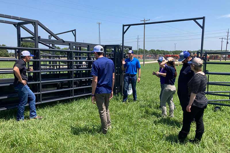 Eric Blythe explains how to set up the corral on site.