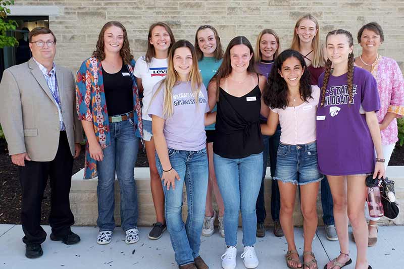 Associate Dean James Roush, Kendra Siefker, Abby Schmoldt, Allie Livingston, Jenna Holt, Morgan D’Albini and Assistant Dean Callie Rost. Front row, from left: Masyn Arena, Katherine Kunkel, Tiffany Lee and Ava Wieser.