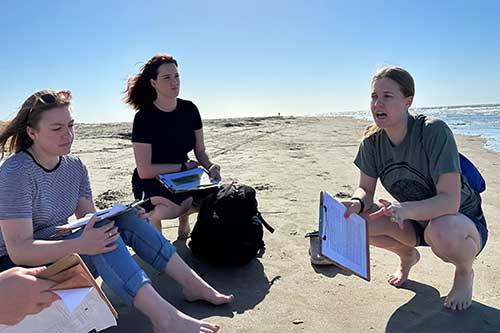 Frontier students conduct exercise on beach
