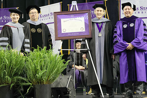 Kansas State University presented Temple Grandin, world-renowned autism spokesperson and livestock industry expert on animal behavior, with an honorary Doctor of Veterinary Medicine degree. From left: Bonnie Rush, Hodes family dean; James Roush, associate dean for academic programs and student success; Grandin; and Richard Linton, K-State president.