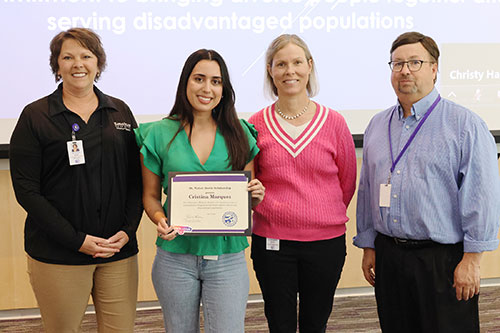 A leadership team in the College of Veterinary Medicine congratulates third-year student Cristina Marquez on being selected as the recipient of the 2023 Dr. Walter C. Bowie Scholarship. From left are Callie Rost, associate dean for admission; Marquez; Elizabeth Davis, associate dean of clinical programs; and James Roush, associate dean for academic programs and student success.