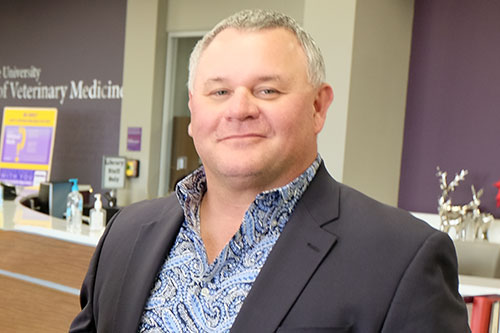 Dr. David Renter hangs out in front of the Vet Med Library checkout counter