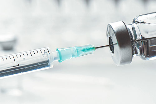 Hypodermic needle with a syringe/vial