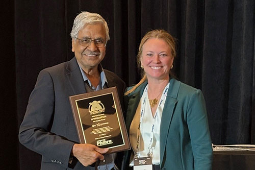 Dr. T.G. Nagaraja receives Phibro award from Haley Stomp