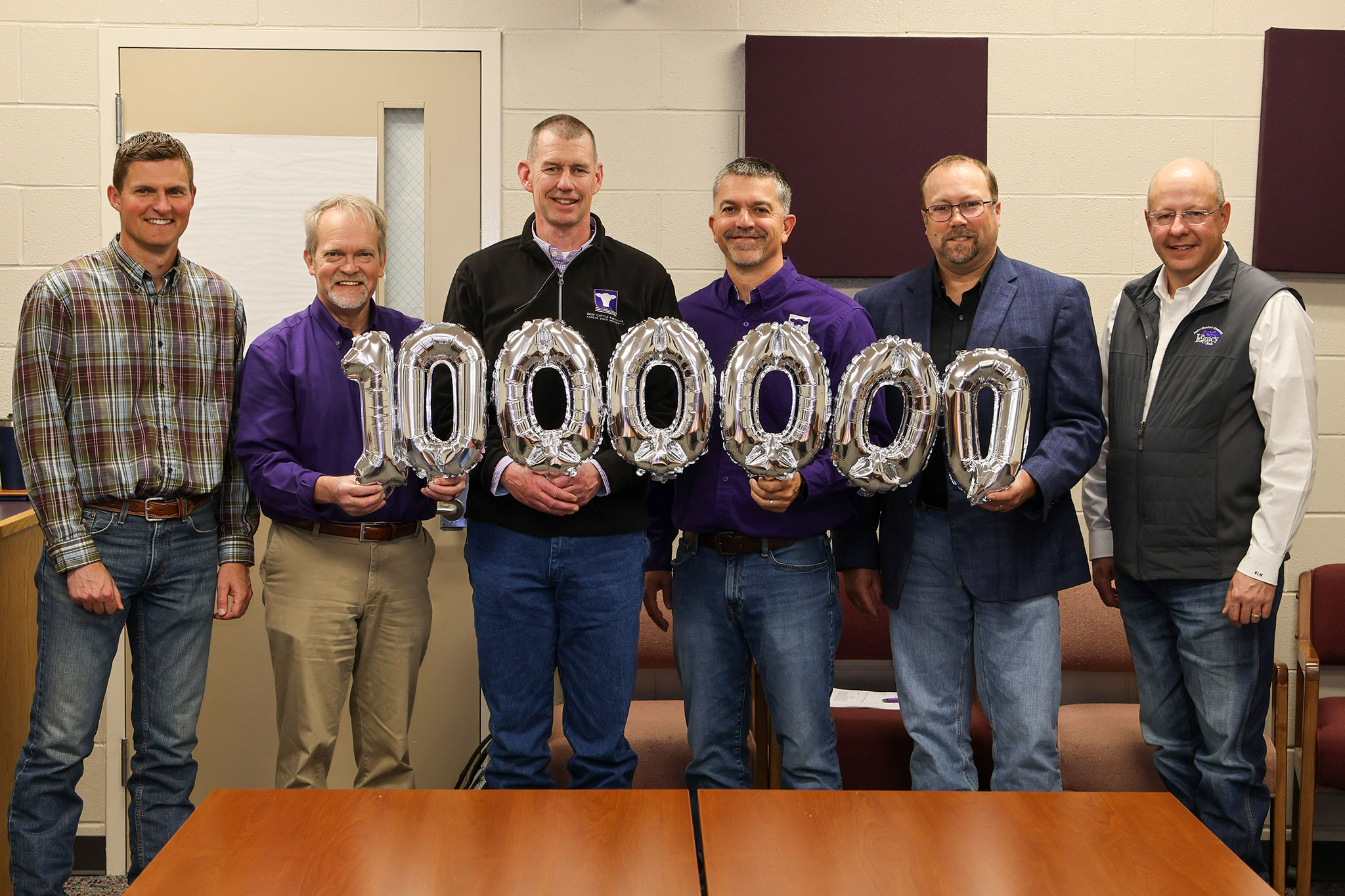 BCI podcasters hold up million balloons