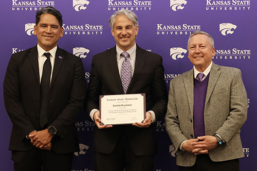 Provost Mendez and President Linton present teaching award to Dr. Justin Kastner