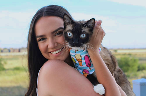 Veterinary student holding a cat