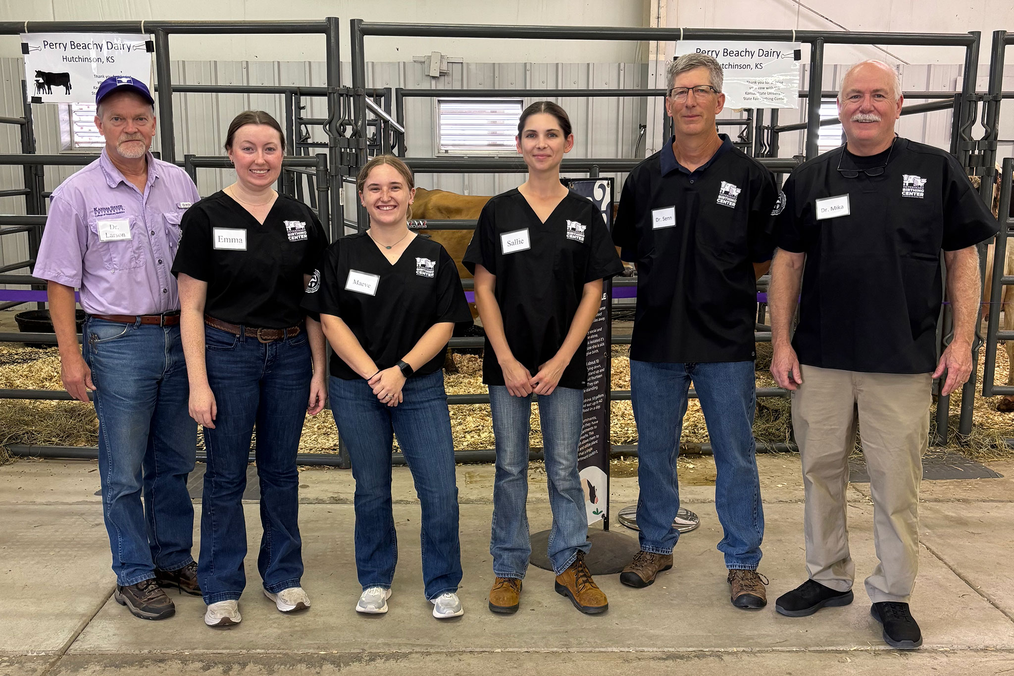 Students and alumni stand for a group photo at the Kansas State Fair