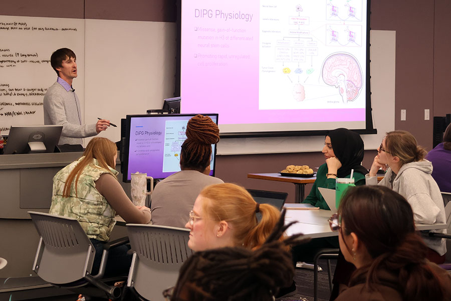 Student gives presentation to classroom