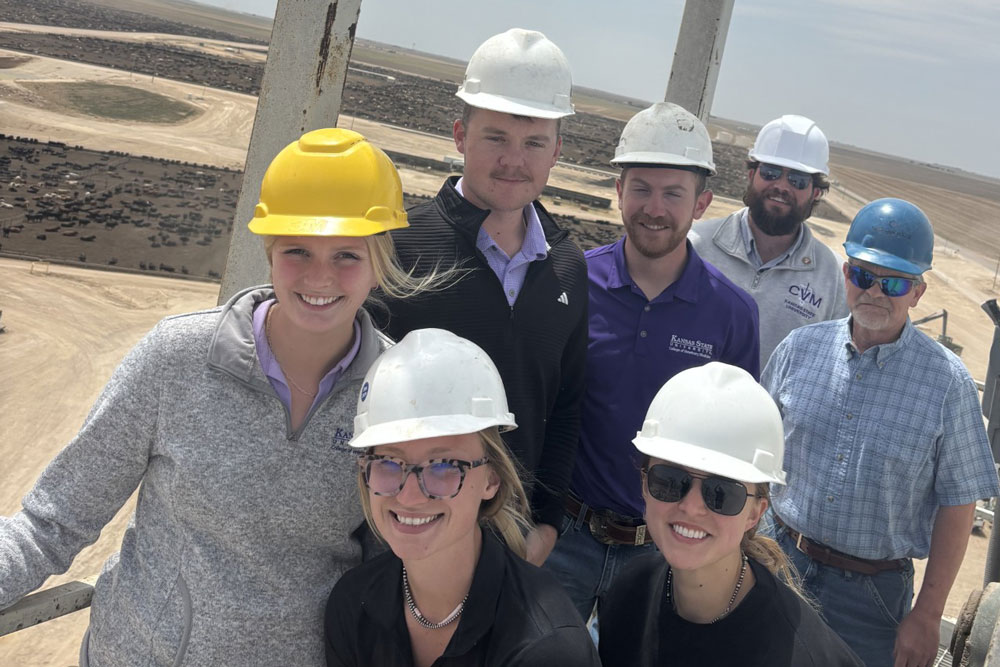 Scholars visiting a feedyard on the trip.