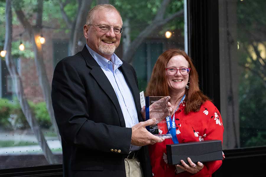 Dr. Mike Apley receives an award from the AAVPT president