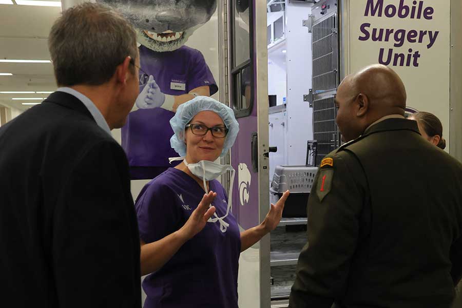 Dr. Dressler tells visitors about the Mobile Surgery Unit