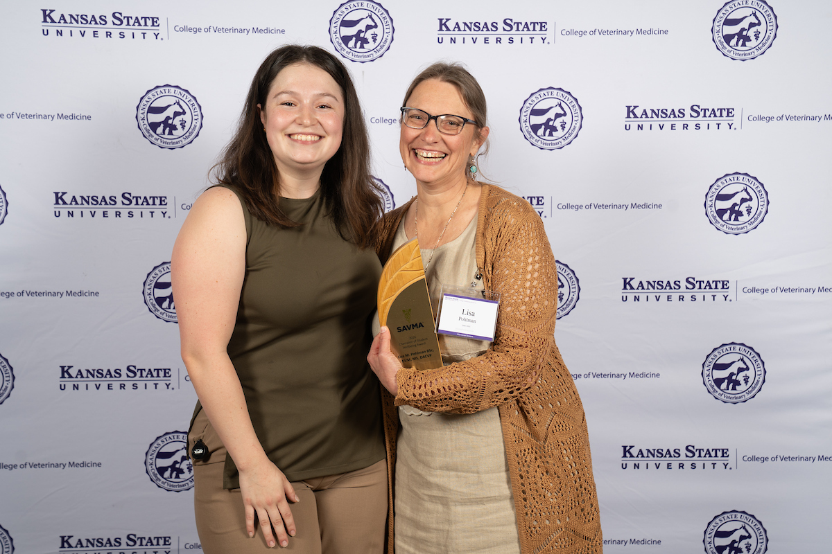 Student presents special award memento to faculty member