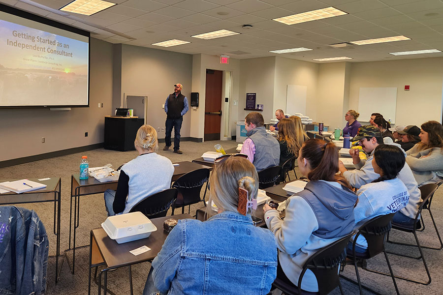 Group of students have a discussion in a classroom