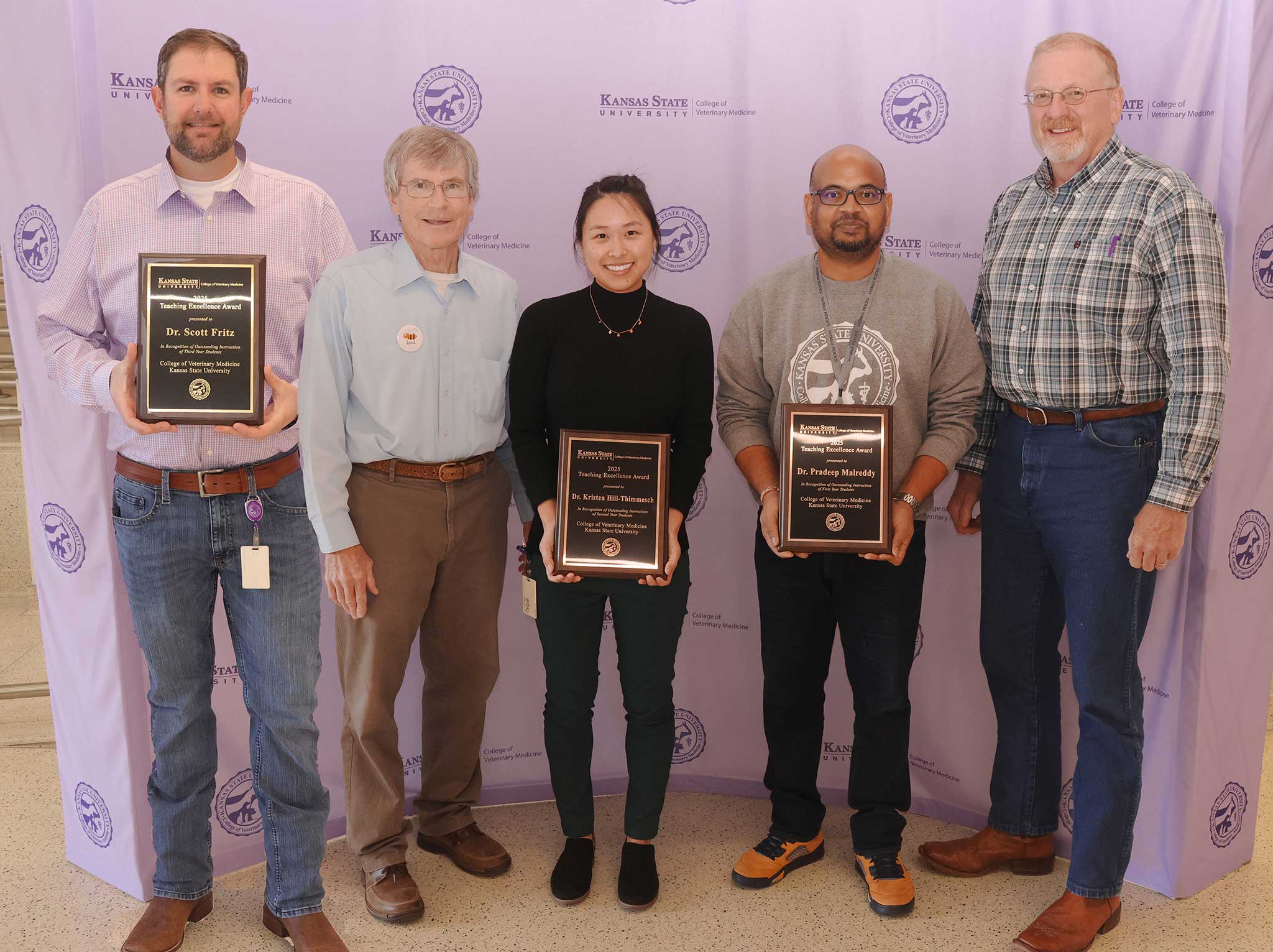 Teaching award recipients pose for a picture.