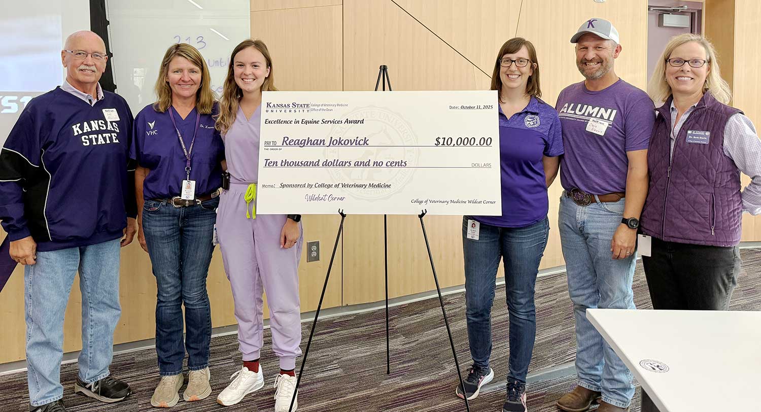 Professors present scholarship to K-State Veterinary student