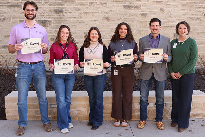 Five students pose with Dr. Caroline Rost