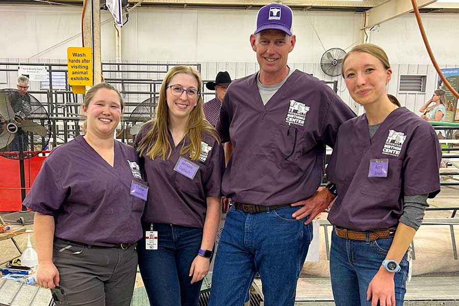 Dr. Brad White helps students at the 2023 Kansas State Fair