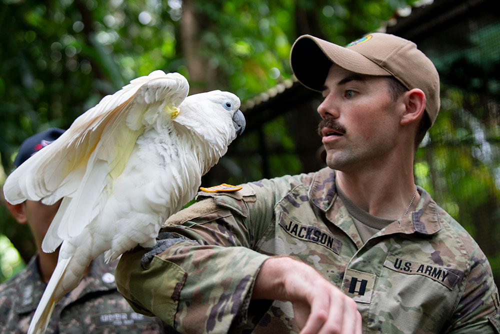 Capt. Jackson with a cockatoo.