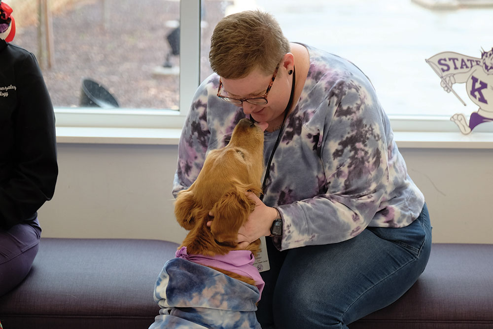 A woman bonds with a dog.