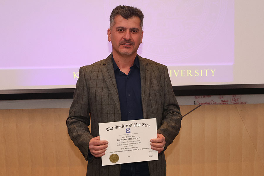 Graduate student holds certificate