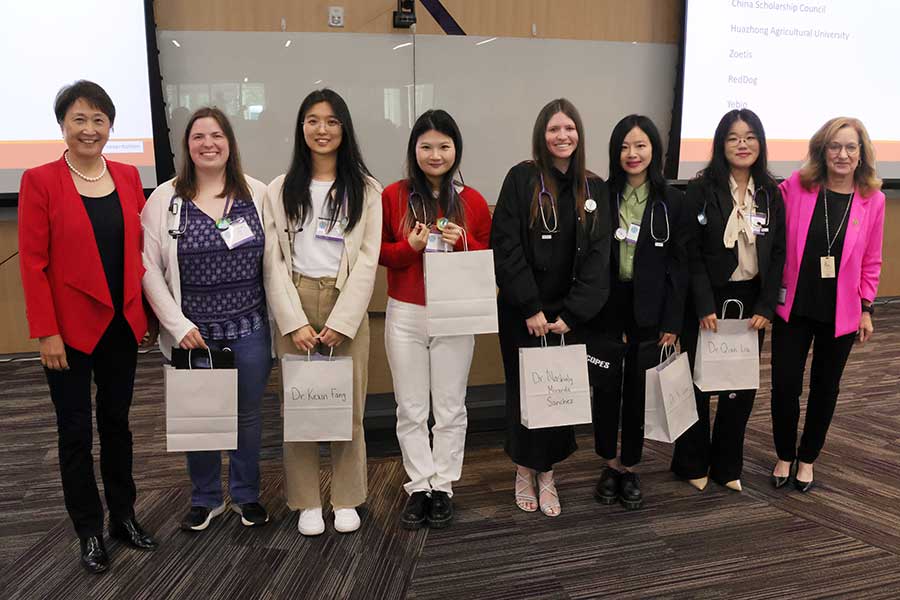 Students wear stethoscopes as US-China Joint DVM graduation gifts
